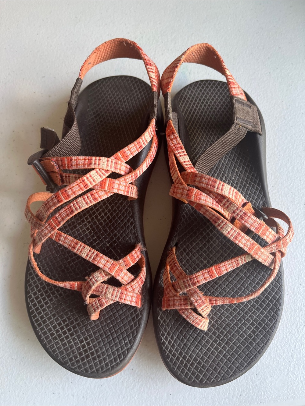 Chaco Women's Strappy Sandals in Orange, pink, and coral pattern